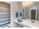 Clean bathroom with vanity, mirror, and shower/tub combo at 208 Angel Wing Dr., Myrtle Beach, SC 29588
