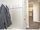 Inviting entryway with coat hooks and view of kitchen at 208 Angel Wing Dr., Myrtle Beach, SC 29588
