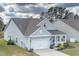 Attractive two-story home with gray siding and a two-car garage at 208 Angel Wing Dr., Myrtle Beach, SC 29588