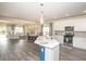 Open concept kitchen with island, stainless steel appliances, and white cabinets at 208 Angel Wing Dr., Myrtle Beach, SC 29588