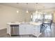 Kitchen island with white cabinets and stainless steel dishwasher at 208 Angel Wing Dr., Myrtle Beach, SC 29588