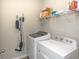 Laundry room with washer, dryer, and shelving at 208 Angel Wing Dr., Myrtle Beach, SC 29588