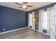 Spacious office with navy walls, wood-look floors and window coverings at 208 Angel Wing Dr., Myrtle Beach, SC 29588