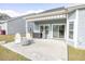 Spacious patio with seating area, grill, and retractable awning at 208 Angel Wing Dr., Myrtle Beach, SC 29588
