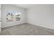 Spacious bedroom with neutral carpeting and large windows at 265 Cypress Tree Loop, Longs, SC 29568