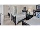 Bedroom with two twin beds, nightstands, and an ensuite bathroom at 4887 Luster Leaf Circle # 201, Myrtle Beach, SC 29577