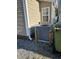 Grey AC unit outside the tan house, next to green bins at 6001-1774 S Kings Hwy., Myrtle Beach, SC 29575