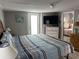 Spacious Primary bedroom with large bed and access to private deck at 6001-1774 S Kings Hwy., Myrtle Beach, SC 29575