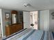 Main bedroom with dresser and striped bedding at 6001-1774 S Kings Hwy., Myrtle Beach, SC 29575