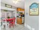 Bright dining area with a red table and four chairs at 6001-1774 S Kings Hwy., Myrtle Beach, SC 29575