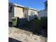 Tan house with green trash cans and AC unit at 6001-1774 S Kings Hwy., Myrtle Beach, SC 29575