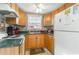 Cozy kitchen featuring wood cabinets and a green countertop at 6001-1774 S Kings Hwy., Myrtle Beach, SC 29575
