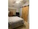 Main bedroom with barn door and ceiling fan at 706 Wintercreeper Dr., Longs, SC 29568