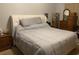 Main bedroom with a king-size bed and wooden dresser at 706 Wintercreeper Dr., Longs, SC 29568