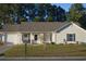 Ranch style home with attached garage and well-maintained lawn at 706 Wintercreeper Dr., Longs, SC 29568