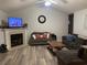 Living room features a fireplace and plenty of seating at 706 Wintercreeper Dr., Longs, SC 29568