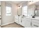 Elegant bathroom with double vanity, large mirror, and a walk-in shower at 7071 Denim Loop, Myrtle Beach, SC 29575