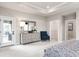 Spacious bedroom with dresser, seating, and access to a private deck at 7071 Denim Loop, Myrtle Beach, SC 29575
