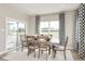 Bright dining room with sliding glass doors leading to a deck at 7071 Denim Loop, Myrtle Beach, SC 29575