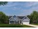 One-story craftsman home with gray siding, stone accents, and a two-car garage at 7071 Denim Loop, Myrtle Beach, SC 29575