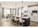 Spacious kitchen with white cabinets, an island, and stainless steel appliances at 7071 Denim Loop, Myrtle Beach, SC 29575