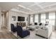 Open living room with coffered ceiling, neutral decor, and large windows at 7071 Denim Loop, Myrtle Beach, SC 29575