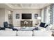 Living room with coffered ceiling, neutral decor, and a built-in media console at 7071 Denim Loop, Myrtle Beach, SC 29575