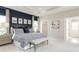 Spacious main bedroom with navy accent wall and large windows at 7071 Denim Loop, Myrtle Beach, SC 29575