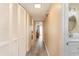 Clean hallway with light wood floors and storage at 105 S Ocean Blvd. # 108, North Myrtle Beach, SC 29582