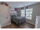 Bedroom featuring a full bed, wood floors, and window at 1264 Brighton Ave., Myrtle Beach, SC 29588