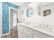 Double vanity bathroom with a blue mosaic tile accent wall at 140 Wimbledon Way # 140, Murrells Inlet, SC 29576