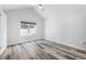 Well-lit bedroom featuring hardwood floors and a ceiling fan at 140 Wimbledon Way # 140, Murrells Inlet, SC 29576