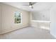 Spacious bedroom with large window and ceiling fan at 140 Wimbledon Way # 140, Murrells Inlet, SC 29576