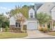 Attractive exterior of a two-story townhome with a brick facade and landscaping at 140 Wimbledon Way # 140, Murrells Inlet, SC 29576