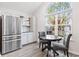 Kitchen breakfast nook with stainless steel appliances and a view to the outdoors at 140 Wimbledon Way # 140, Murrells Inlet, SC 29576