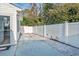 Private patio with brick pavers and white fence at 140 Wimbledon Way # 140, Murrells Inlet, SC 29576