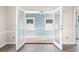 Sunroom with tile flooring and French doors at 140 Wimbledon Way # 140, Murrells Inlet, SC 29576