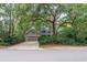 House exterior featuring a two-car garage and mature landscaping at 142 Rybolt Rd., Pawleys Island, SC 29585