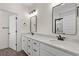 Double vanity bathroom with marble countertop and large mirror at 1503 Red Bluff Rd., Loris, SC 29569