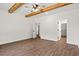 Large bedroom with wood-look floors, ceiling fan, and walk-in closet at 1511 Red Bluff Rd., Loris, SC 29569