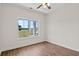 Bright bedroom featuring hardwood floors and a window at 1511 Red Bluff Rd., Loris, SC 29569