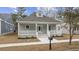 Gray house with white trim and porch, steps leading to the front door at 156 Bridge View Rd., Georgetown, SC 29440