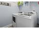 Bright laundry room, featuring washer, dryer, and ample shelving at 220 Portsmith Dr. # 7, Myrtle Beach, SC 29588