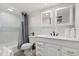 Clean bathroom with white vanity, grey shower curtain, and mosaic backsplash at 2001 S Ocean Blvd. # 916, Myrtle Beach, SC 29577