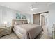 Main bedroom with king-size bed, sliding barn door, and wood-look flooring at 2001 S Ocean Blvd. # 916, Myrtle Beach, SC 29577