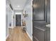 Light-filled entryway with hardwood floors and a bench at 205 Black Pearl Way, Myrtle Beach, SC 29588