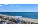 Beachfront home view with ocean, beach, and pier in the background at 219 South Seaside Dr., Surfside Beach, SC 29575