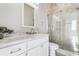 Bathroom with white vanity, marble countertop, and glass shower at 219 South Seaside Dr., Surfside Beach, SC 29575
