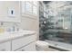Clean bathroom with single sink, white vanity, and a walk-in shower at 219 South Seaside Dr., Surfside Beach, SC 29575
