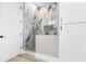 Modern bathroom with a walk-in shower, marble tile, and a sleek design at 219 South Seaside Dr., Surfside Beach, SC 29575